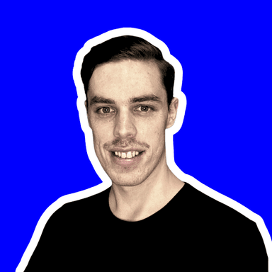 Profile Picture of Marc Domancie - A headshot of Marc Domancie, smiling, with a blue circular background.